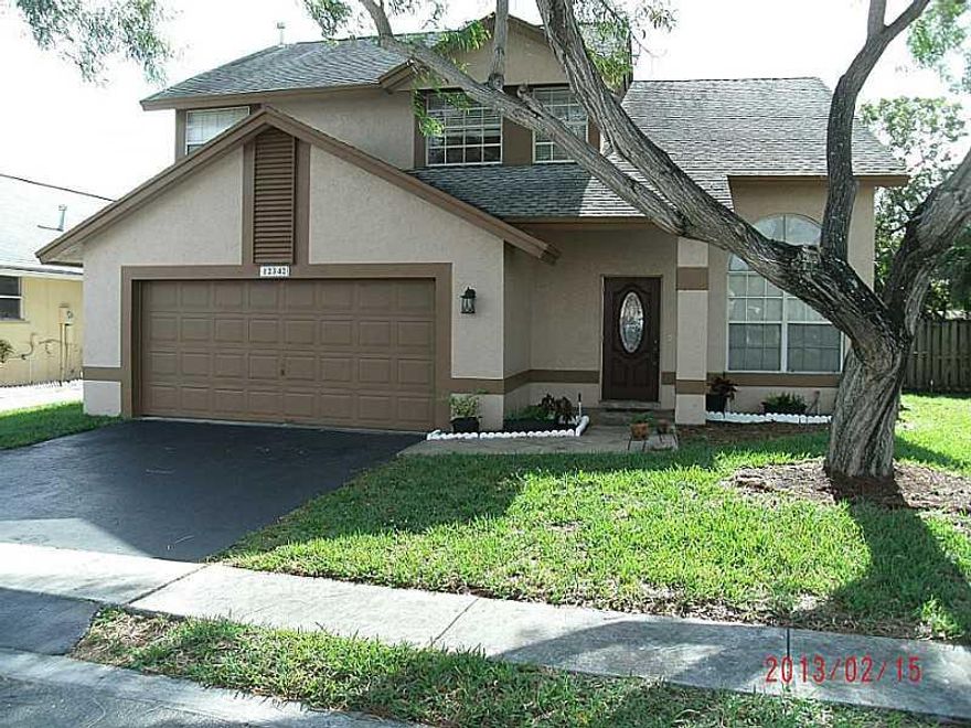 UPGRADES GALORE!!! BEAUTIFUL 4/2.1 TWO STORY HOME IN SAWGRASS ESTATES. REMODELED KITCHEN WITH NEWER APPLIANCES. TILE, WOOD & LAMINATE FLOORING THROUGHOUT THE ENTIRE HOME. INCREDIBLE MARBLE & WOOD STAIRCASE. ALL OF THE BATHROOMS HAVE BEEN TASTEFULLY REMODE LED. TWO CAR GARAGE WITH TILED FLOOR.  CROWN MOLDING & UPGRADED BASE BOARDS THROUGHOUT MOST OF THE HOME. YOU WILL FEEL AT HOME THE MINUTE YOU WALK THROUGH THE BEAUTIFUL CUSTOM DOOR AT THE ENTRANCE TO YOUR NEW HOME.