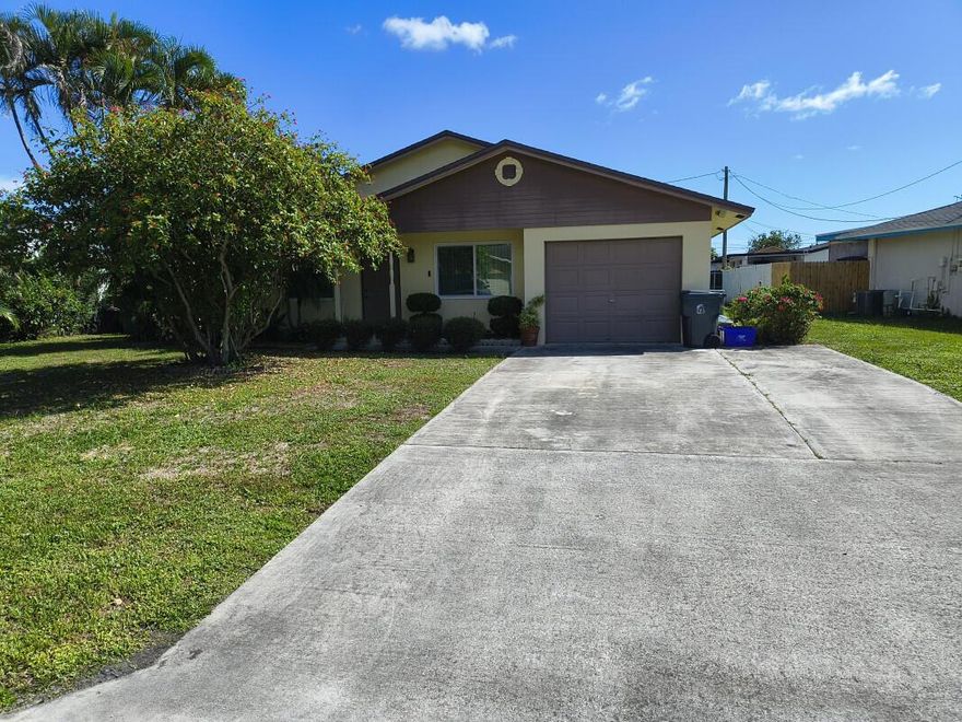With no HOA restrictions, this one story home features 3 bedrooms,2 baths and 1174 square feet of thoughtfully designed living space. There is an additional 600 square feet of living space that includes a screen in porch and 1 car garage. An eat in kitchen complete with a convenient pass-through to the living areas. Each bedroom has its own closet and the master bath has recently been upgraded. Outdoors enjoy a spacious backyard which is perfect for relaxation or entertaining. The property includes a one car attached garage which also houses a recently purchased washer and dryer. The central A/C is approximately 3 years old. Close to parks, shopping and Palm Beach State College.