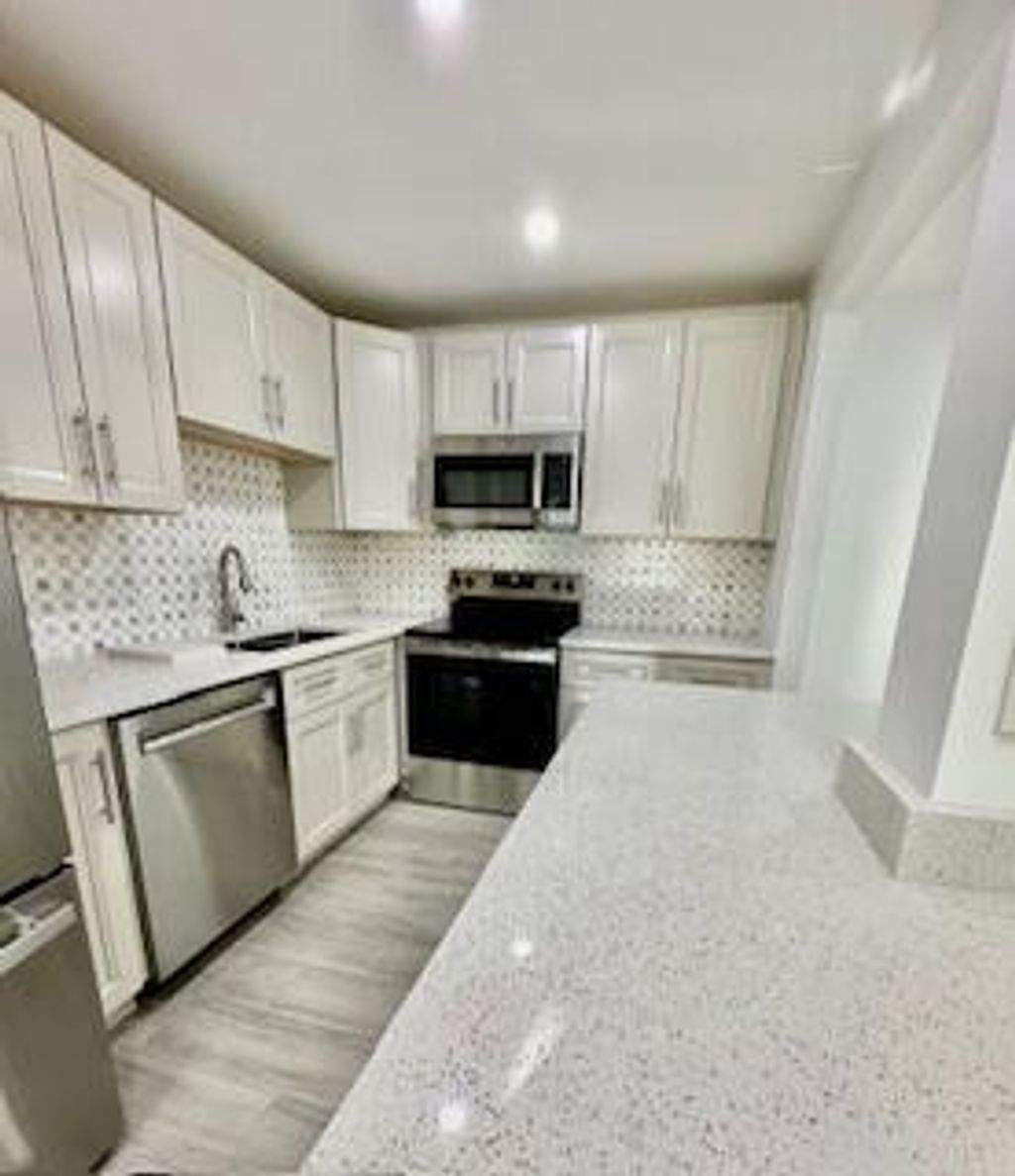 Photo of 105 E Coventry E #105, West Palm Beach, FL 33417 (MLS # B26002245)