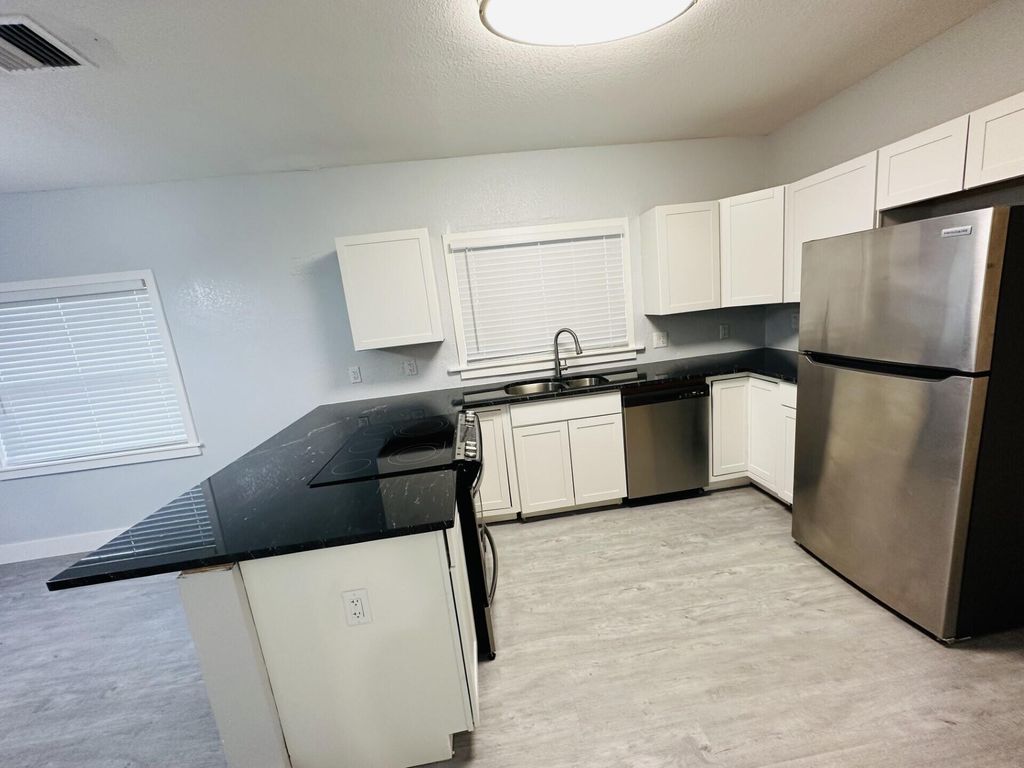 Photo of 410 N E Street, Lake Worth Beach, FL 33460 (MLS # R10967374)