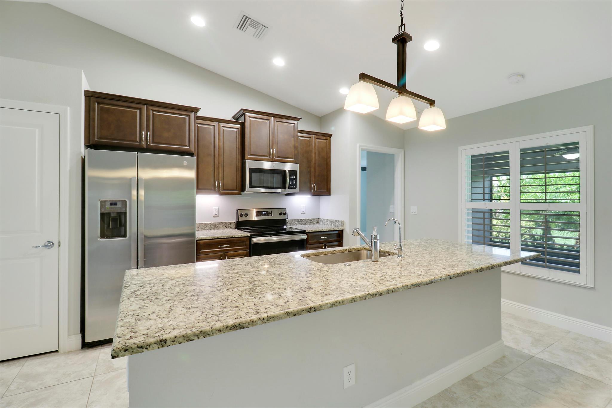 4 beds, 2 baths, south of Becker Rd close to 95 and the Turnpike, complete impact glass, built in 2020, plantation shutters, all tile throughout, whole house automatic generator, fully fenced back yard, large screened back patio, and water purification system. Extensive landscaping in front and backyard. Must see in person to fully appreciate. Full list of upgrades in Documents in MLS.