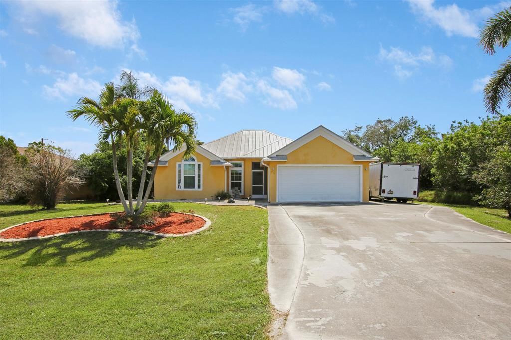 Photo of 715 SW Hogan Street, Port Saint Lucie, FL 34983 (MLS # R10714016)