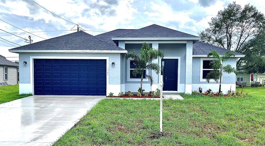 Photo of 1542 SW Flagami Road, Port St Lucie, FL 34953 (MLS # R10919954)