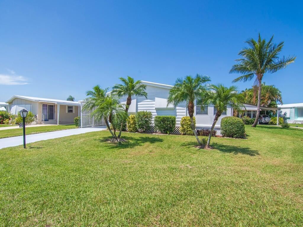 Photo of 66 NE Pinelake Village Boulevard, Jensen Beach, FL 34957 (MLS # R11109175)