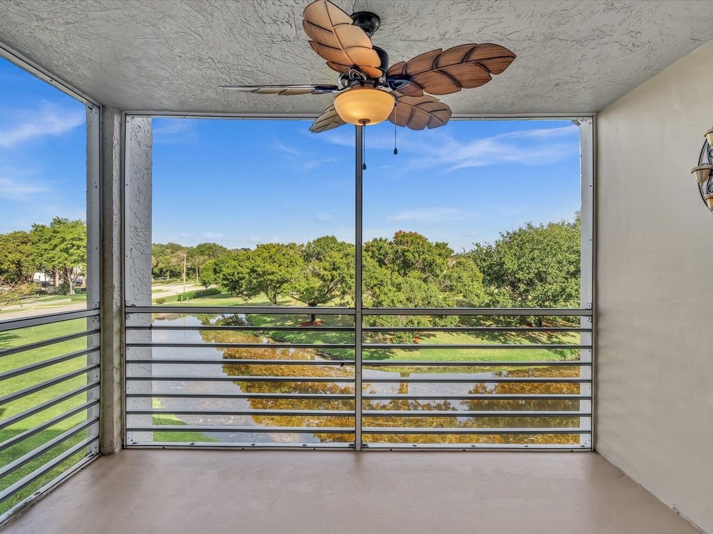 Photo of 9470 Poinciana Place #303, Davie, FL 33324 (MLS # B26021091)