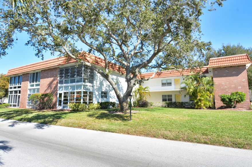 Cozy Coastal Décor invites you to relax in this first floor 1 bedroom condo with an extra powder room for guest's convenience. Spacious living/dining area, bedroom with it's full wall of closets make this condo feel huge! The main bath has been updated with a fully tiled walk-in shower. Updated hurricane rated windows and sliders bring piece of mind with insurance-friendly costs. Windows on the lanai with it's view of the lagoon have also been updated. You will feel right at home  whether you keep the current custom furnishings and décor or bring your personal touches.  Perfect location just steps away from the clubhouse, pool and amenities. This is an Active 55+ community in the Stuart/Jensen Beach area. Adjacent to North River Shores public golf course. Convenient location close to the Treasure Coast Mall, restaurants, entertainment, etc. This is a beautiful, well-maintained 55+ community with lush landscape, walking paths, lakes, pool, clubhouse, library and so much more. No trucks, motorcycles or commercial vehicles. Must own for 2 years before renting.