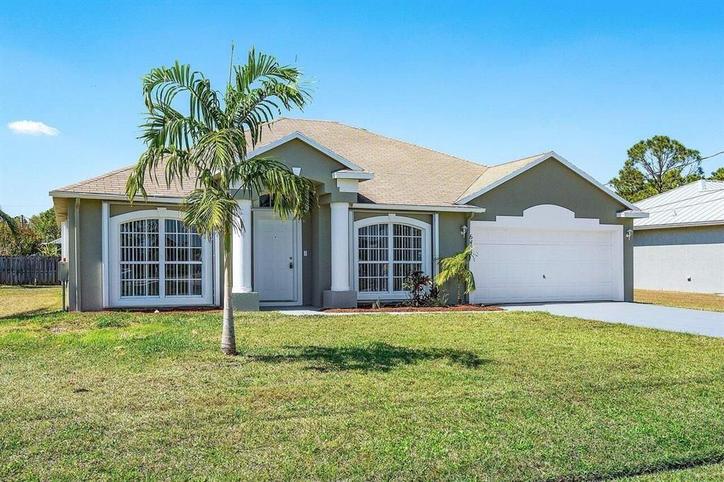 Photo of 6454 NW Flair Street, Port St Lucie, FL 34986 (MLS # R10872673)