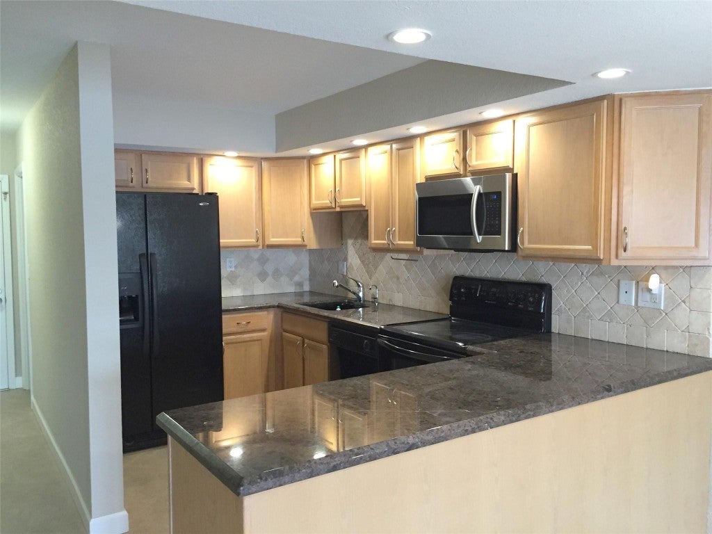 Photo of 1100 Crystal Lake Drive #110, Deerfield Beach, FL 33064 (MLS # F10538191)