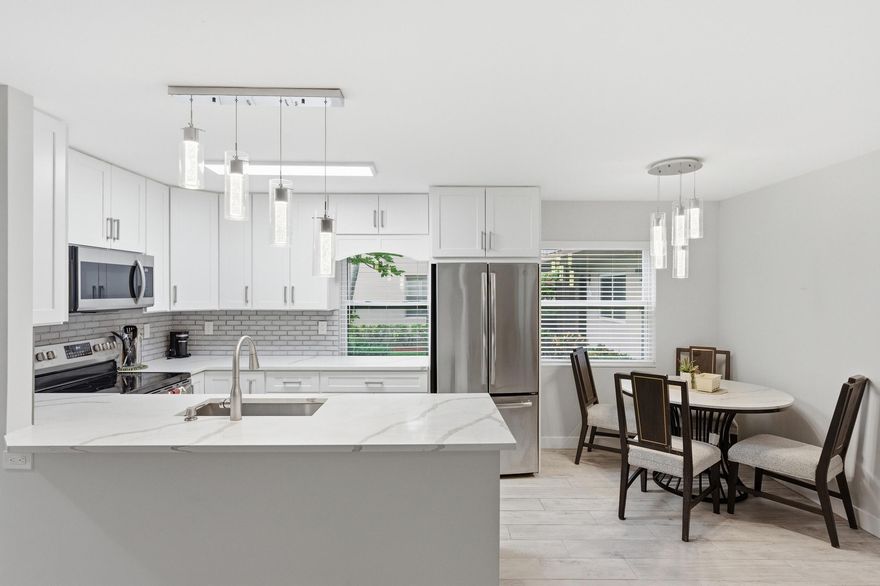 Welcome to this beautifully updated first-floor 2/2 residence in Kings Point Delray Beach, offering comfort, style, and convenience in a vibrant 55+ community. This move-in-ready home features full impact windows, all tile flooring throughout, and a bright, open white kitchen with stainless steel appliances. The interior is enhanced with smooth ceilings (no popcorn) and a thoughtfully designed layout, including a hallway slider for added privacy to the primary suite. Both bathrooms have been fully renovated and feature modern walk-in showers. Additional highlights include a newer washer and dryer with updated vanities in the laundry room, a General Electric electrical panel, A/C (2019), and water heater (2022).   Enjoy relaxing mornings or evenings on the screened-in patio, all from the convenience of a first-floor location. Kings Point offers resort-style amenities including multiple clubhouses, indoor and outdoor pools, fitness centers, golf courses, tennis courts, theater, courtesy bus service, and a full calendar of social activities. Rental Policy: 1-year waiting period before leasing.