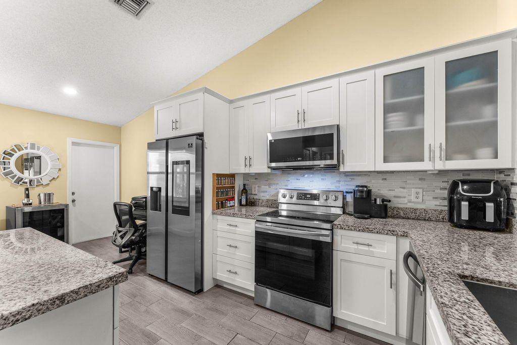 Photo of 12195 Forest Greens Dr, Boynton Beach, FL 33437 (MLS # B26000354)