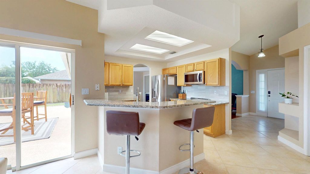 Photo of 3541 SW Kromrey Street, Port Saint Lucie, FL 34953 (MLS # R11078541)