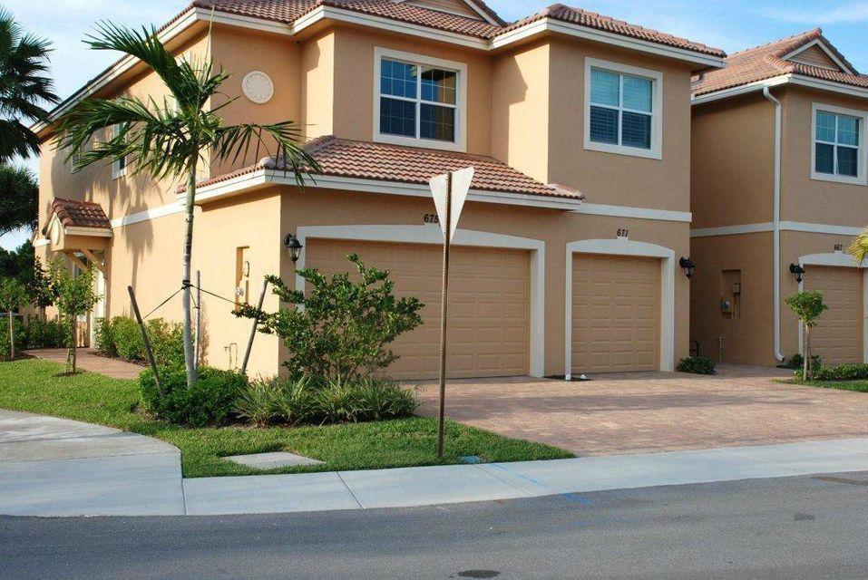 Amazing immaculate 3 bedroom 2.5 bath 2 car garage end unit lake view townhome in River Glen in Stuart. This lovely townhome still has that brand new feel. Features and upgrades include granite kitchen countertops, stainless steel appliances, hurricane impact glass, large tile set on the diagonal, extra fluffy carpet on the stairs and second level, a large pantry, an open rear paver patio overlooking a lake, a generous number of hi hat lights, upgraded light fixtures and ceiling fans, a community swimming pool and more. Very low rental inventory and this quality upgraded townhome will not last.