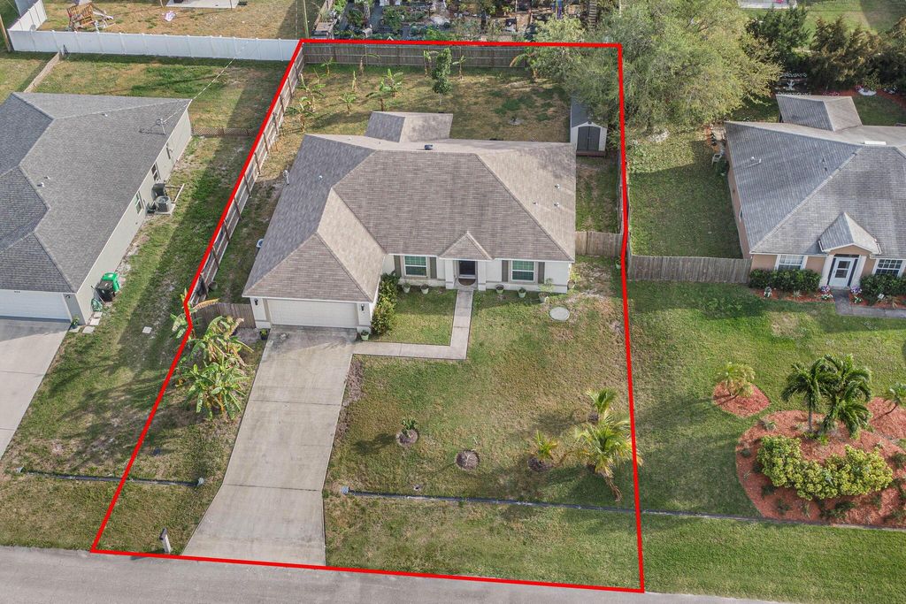 Photo of 654 SW Backert Avenue, Port Saint Lucie, FL 34953 (MLS # R10966071)