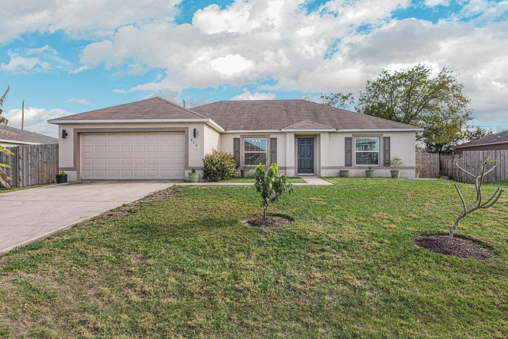 Photo of 654 SW Backert Avenue, Port Saint Lucie, FL 34953 (MLS # R10966071)