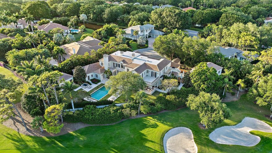 European-inspired 7-bedroom, custom estate home on .65 acres in Frenchman's Creek, overlooking the golf course. Built in 2004 with poured concrete, impact windows, a brand new roof, and Lutron light touch system. Grand entrance with dramatic double staircase and view of the resort-style backyard with pool, spa, summer kitchen, and cabana with sauna. A well-designed floor plan includes expansive owner's suite with dual baths, custom closets, and sitting room. Chef's kitchen, wine room, bar, library, multiple living/dining spaces, elevator, laundry room + dog wash. Upstairs offers 5 ensuite bedrooms with terraces, a one-of-a-kind game room and 2nd laundry room. Attached 2-car and add'l 2.5-car garage, both A/C'd. Large office and apartment sit above the separate garage. As an added value,