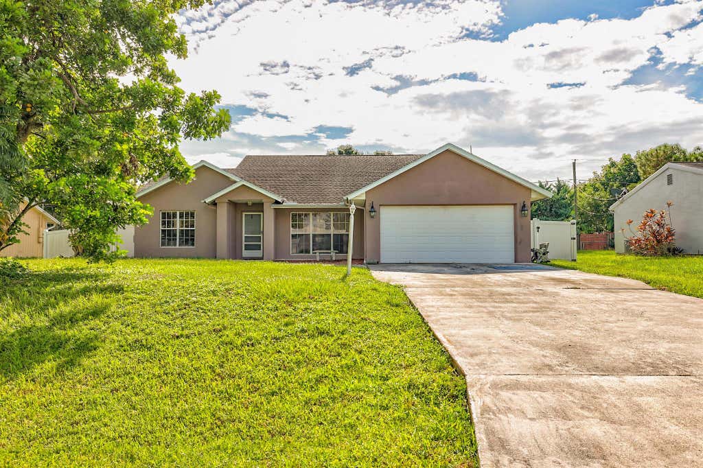 Photo of 1961 SE Carvalho Street, Port St Lucie, FL 34983 (MLS # R10912692)