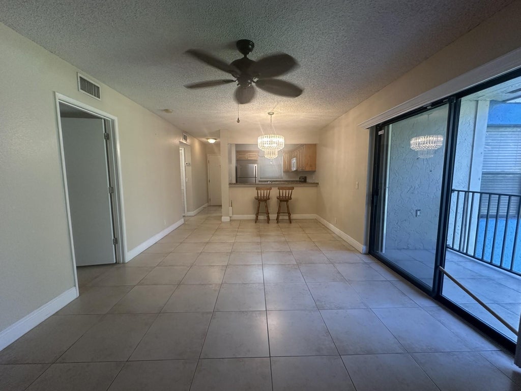 Photo of 1680 WINDORAH Way #E, West Palm Beach, FL 33411 (MLS # B26071566)