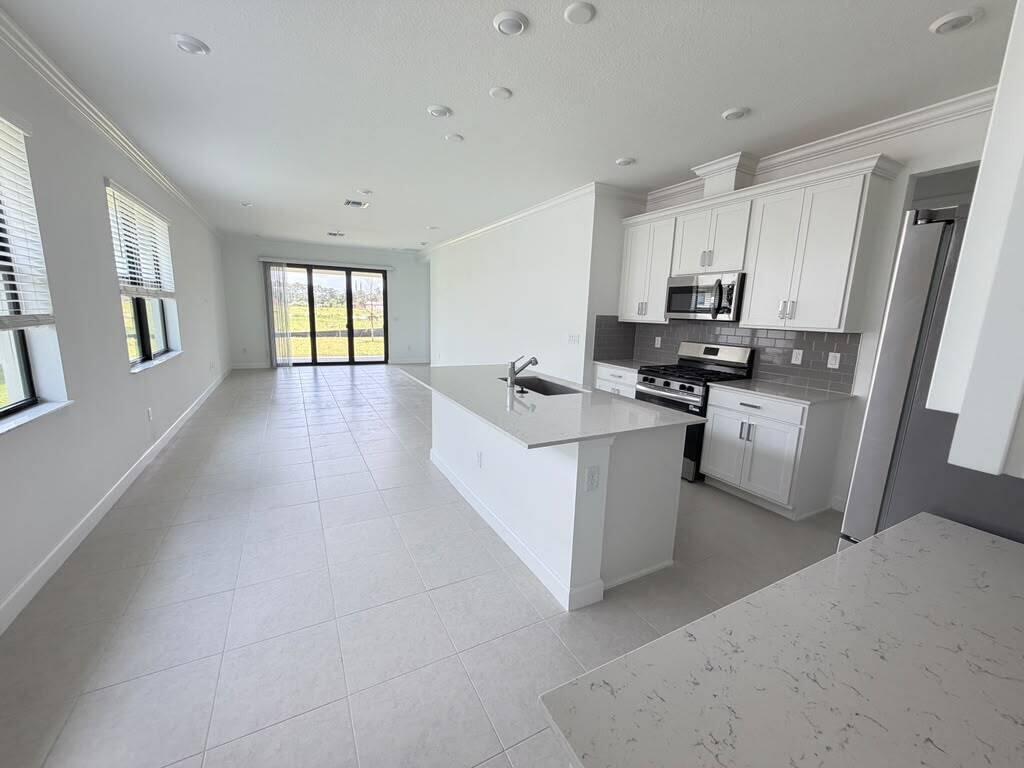 Photo of 10676 NW Wilgrove Lane, Port Saint Lucie, FL 34987 (MLS # B26078112)