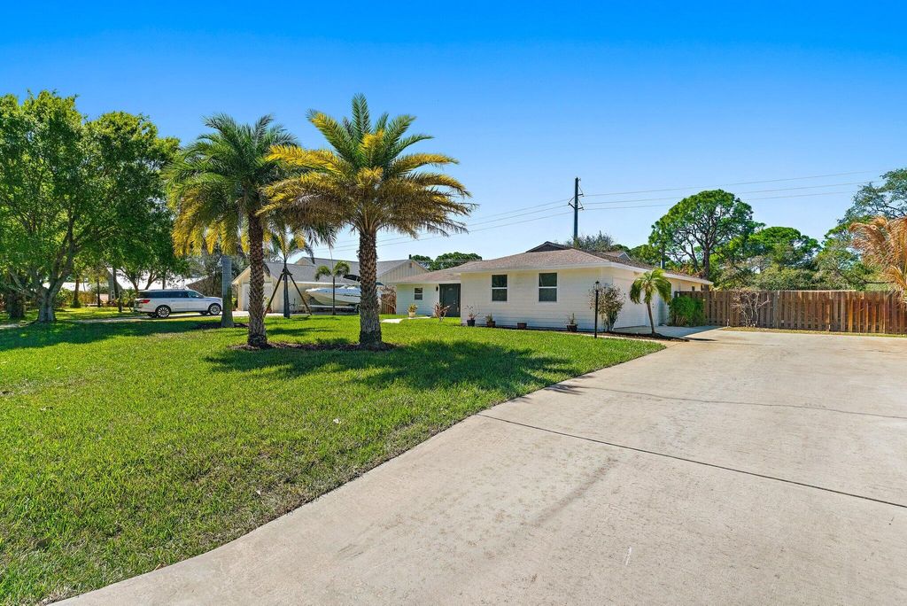 Photo of 5883 Set N Sun Place, Jupiter, FL 33458 (MLS # R11166583)