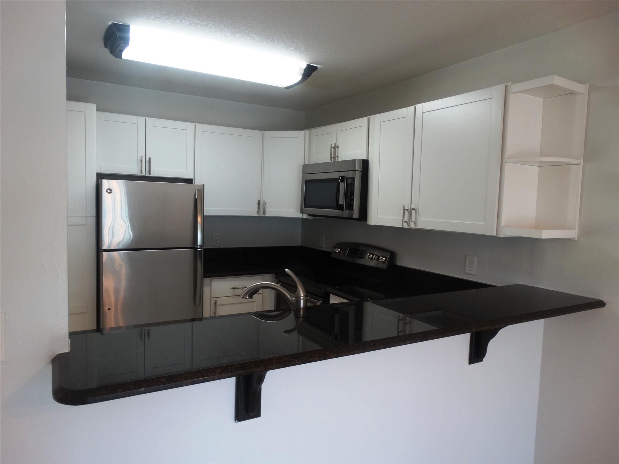 1st floor end unit directly on the canal. The only water view is from the porch. Boat docks located right outside porch door. Kitchen has been opened up to make bar seating. S/S appliances and granite tops. Terrific location between both bridges and directly across from Miracle Mile. Community pool with kayak storage and clubhouse. Water, sewer and trash included. No smoking in unit. No pets. No age restriction.
Close