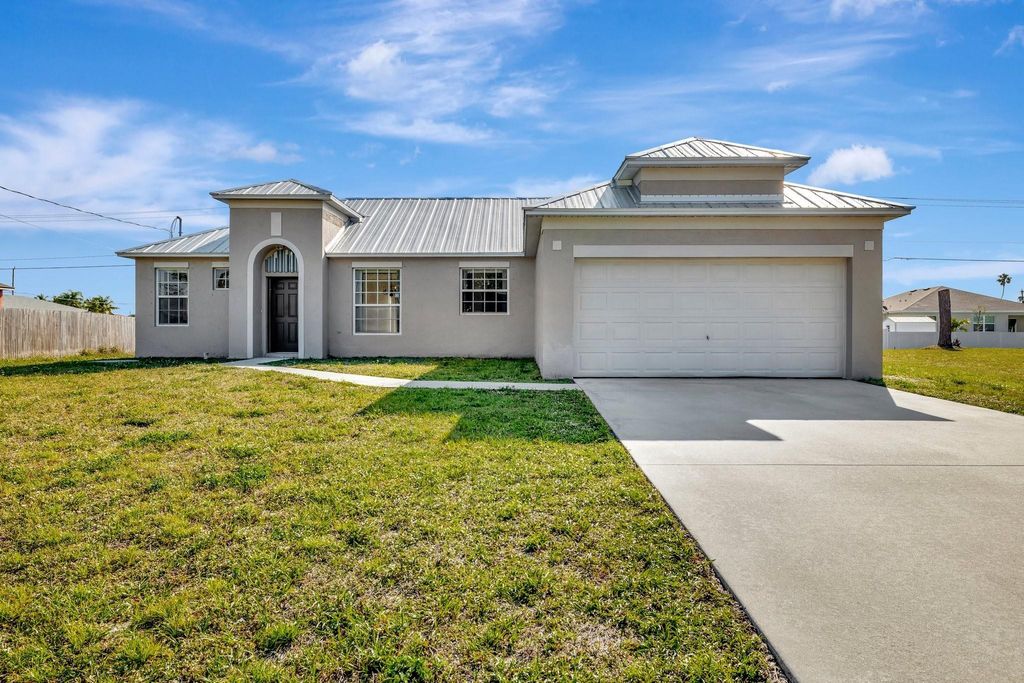 Photo of 423 NW Ravenswood Ln, Port Saint Lucie, FL 34983 (MLS # F10512019)