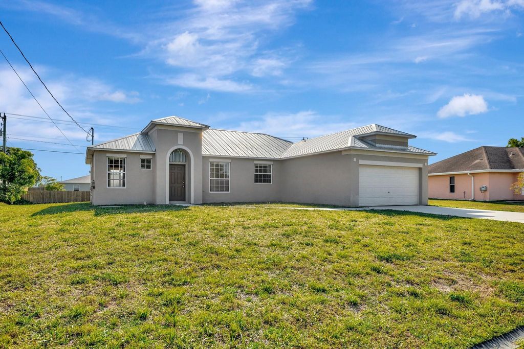 Photo of 423 NW Ravenswood Ln, Port Saint Lucie, FL 34983 (MLS # F10512019)