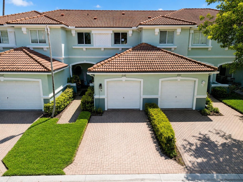 Photo of 2145 Oakmont Drive, Riviera Beach, FL 33404 (MLS # B26073690)