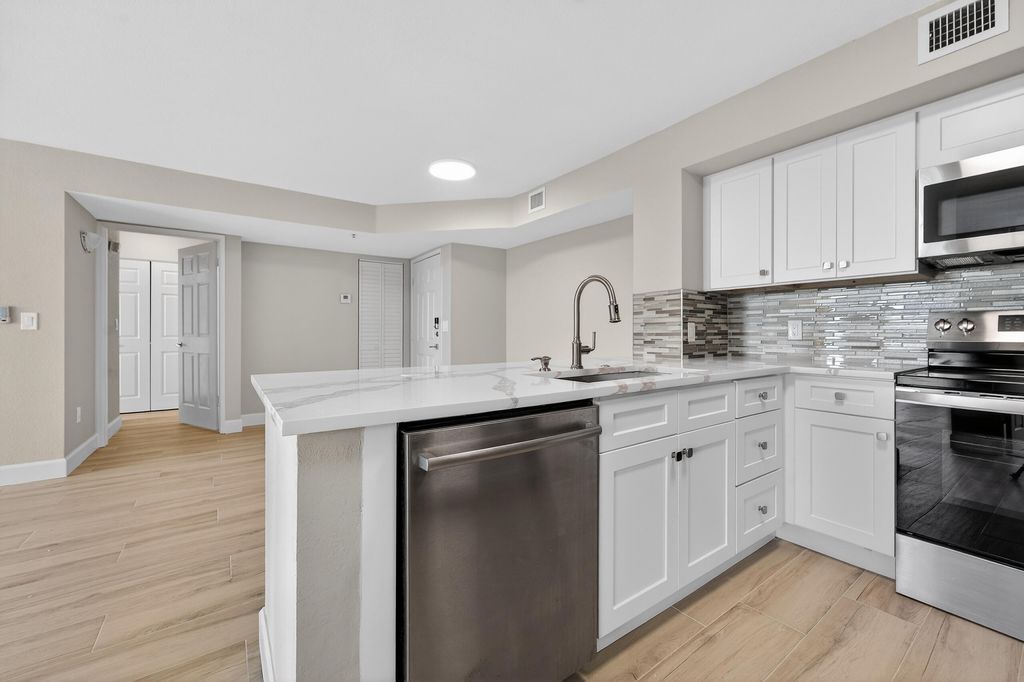 Photo of 167 Yacht Club Way #104, Hypoluxo, FL 33462 (MLS # R11149074)