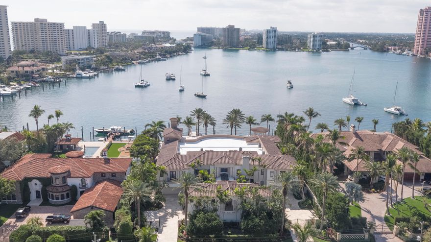 One of Lake Boca Raton’s best viewpoints is reserved for this imposing gated compound on 150± feet of shoreline, looking all the way down the water and surrounding coastline to the historic Boca Raton Resort & Club.  Unobtrusively placed to the side, the rare cut-in yacht slip is large enough for a 120±-foot vessel and is close to the inlet.  Additional dockage can berth another 75±-foot yacht.  Designed for large-scale gatherings, the sensational outdoor entertainment space centers on the 63±-foot infinity pool and grand loggia with a summer kitchen/bar, cabana bath, and boat equipment storage.  Exotic Medjool date palms are signature elements of the lush tropical landscaping. DISCLAIMER: The written and verbal information provided including but not limited to prices, measurements, square footages, lot sizes, calculations and statistics have been obtained and conveyed from third parties such as the applicable Multiple Listing Service, public records as well as other sources. All information including that produced by the Sellers or Listing Company are subject to errors, omissions or changes without notice and should be independently verified by any prospect for the purchase of a Property.  The Sellers and Listing Company expressly disclaim any warranty or representation regarding all information.  Prospective purchasers' use of this or any written and verbal information is acknowledgement of this disclaimer and that Prospects shall perform their own due diligence.  Prospective purchasers shall not rely on any written or verbal information provided when entering a contract for sale and purchase.  Some affiliations may not be applicable to certain geographic areas. If your property is currently listed, please do not consider this a solicitation. In the event a Buyer defaults, no commission will be paid to either Broker on the Deposits retained by the Seller.  "No Commissions Paid until Title Passes."  Copyright 2018 Listing Company. All Rights Reserved.