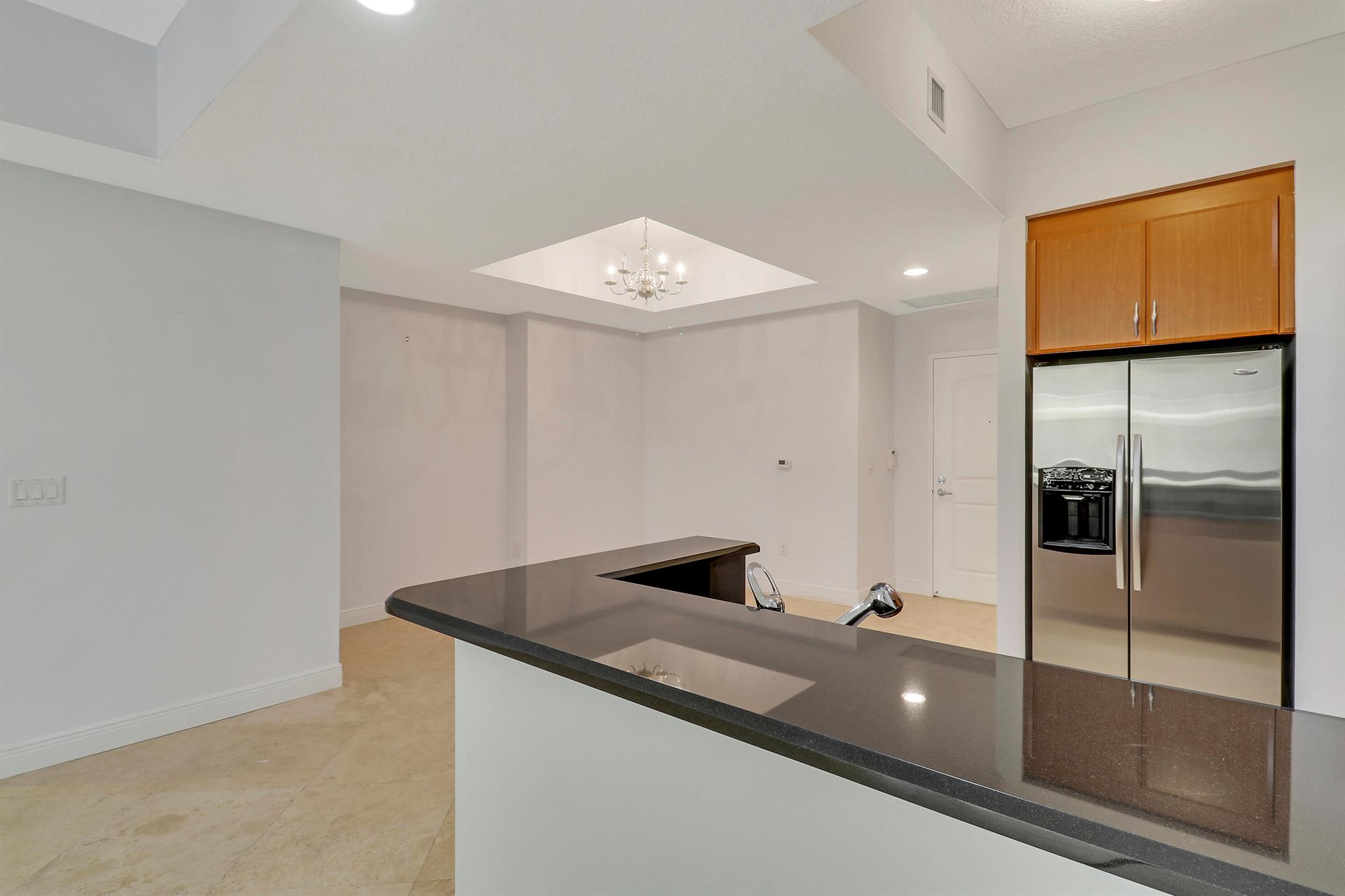 Welcome to this beautiful two-bedroom, two-bathroom split floor plan home, meticulously maintained and ready for immediate move-in. Featuring luxurious Saturnia marble flooring throughout, this residence exudes elegance and sophistication. The sun-filled, light and bright interior creates a welcoming atmosphere perfect for comfortable living. The kitchen boasts 42'' cabinets, granite countertops, and a stainless steel appliance package. The marbled master bath offers a spa-like retreat with upscale finishes, providing a perfect oasis for relaxation. Ample closet space ensures plenty of storage, complemented by an assigned garage parking spot and a private storage locker for added convenience. This immaculate condo combines luxury, functionality, andand move-in readiness.