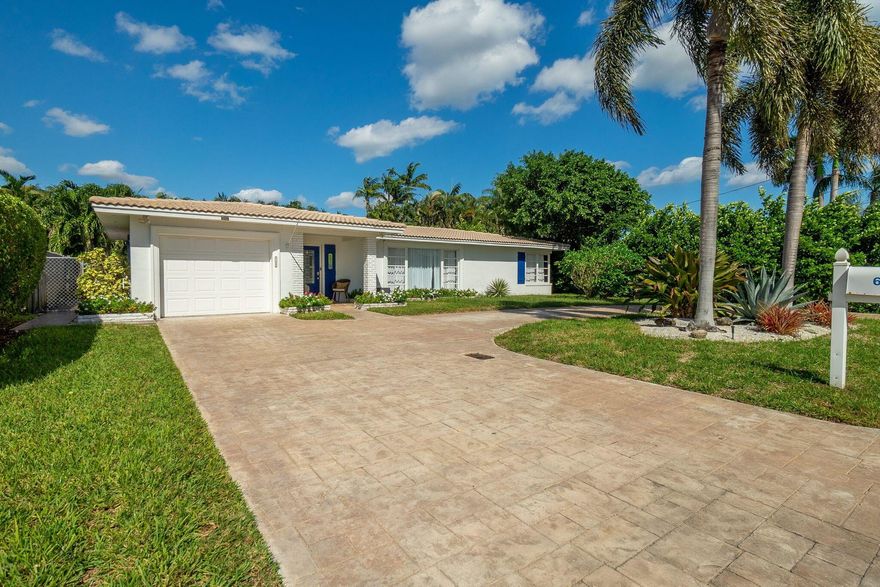 Discover the perfect coastal lifestyle in the Intracoastal neighborhood of Coquina Cove! This bright and updated home offers a modern kitchen, sun-filled open layout, and inviting spaces ideal for comfortable everyday living. Relax in the private fenced yard or unwind on the screened patio after a day in the sun. The circular driveway and 1-car garage provide plenty of room for your boat, RV, or guests. Conveniently located less than a mile from the public Boynton Beach Boat Ramp just across from the inlet to the Atlantic Ocean and within walking distance to the beach. No HOA and close to waterfront dining, Delray Beach, and Palm Beach. Enjoy the best of South Florida living at Coquina Cove!