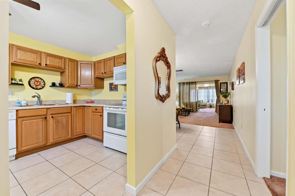 Photo of 5725 Fernley Drive E #8, West Palm Beach, FL 33415 (MLS # B26019875)