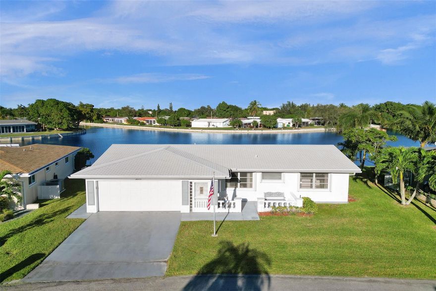 Come and enjoy breathtaking views from your very own back yard! You will have lots of space in this large 2 bedroom 2 bath home located on the widest part of the lake. Formal living and dining room. Eat in kitchen, family room plus a screened in patio. The seller has improved this home with New roof (2 yrs old) Brand new hot water heater. Newer A/C! New electrical panel. Accordion Shutters and more. 55+ community. HOA includes lawn care, sprinklers, clubhouse and community pool. Hurry and see this one before it's gone!