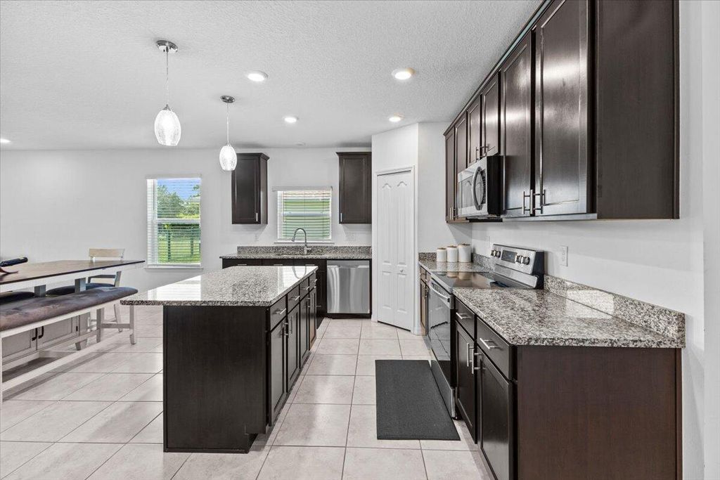 Photo of 3426 SW Pluto Street, Port Saint Lucie, FL 34953 (MLS # R11106816)