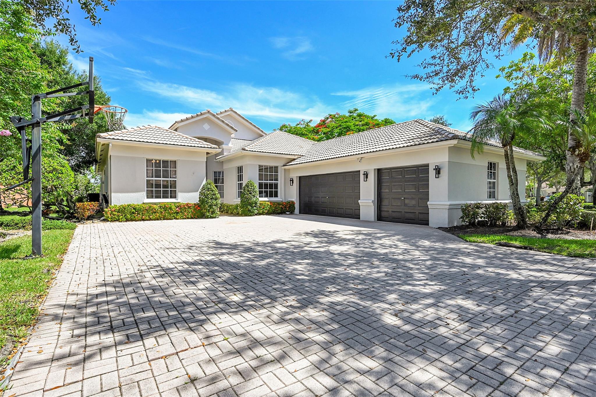 Exquisitely fully renovated designer home on a rare 1/3 acre cone-shaped corner lot with stunning water views and unforgettable sunsets. The remodeled Master piece with Taj Mahal quartzite kitchen, 10-ft waterfall island, brand new Café appliances, 24x48 matte porcelain tile, spa-style baths with floating vanities, lighted mirrors, jets, and freestanding tub in master. Smart home with Alexa, electric fireplace, custom night lighting, lush landscaping, and a newly renovated pool with heater. Tucked away in one of Parkland’s most desirable neighborhoods and zoned for top-rated schools This is not just a home, it’s a statement. Schedule your private tour today. Homes like this are rarely available and never last long. This home won't disappoint!