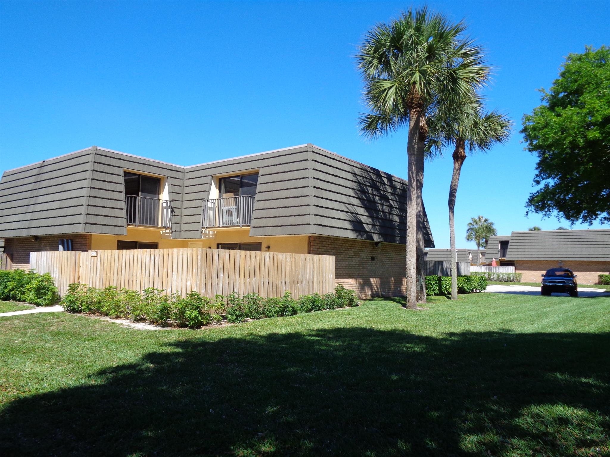 Come live in this bright townhouse in the Villages of Sandalwood. Minutes to the new outlet mall, beaches, city place and downtown. This unit has updated floors, stainless steel appliance, newer AC, completely renovated. Dual sinks and walk-in closet in master bedroom. private fenced patio, balconies in both bedrooms, each bedroom has it's bathroom. Eat-in Kitchen area. Granite countertops. Community offers swimming pools, play grounds, tennis, basketball and picnic areas. Rent includes water and basic cable.
