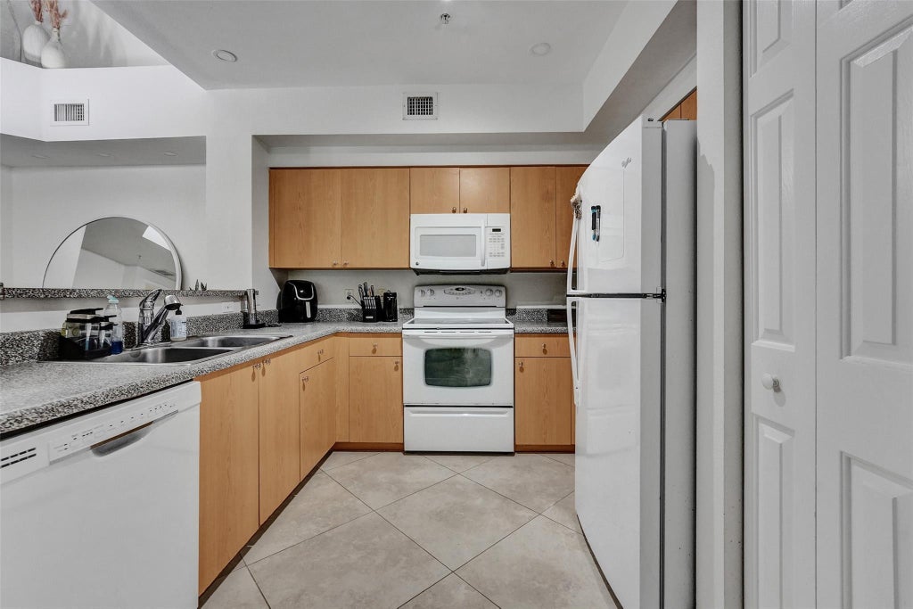 Photo of 7940 N NOB HILL Road #304, Tamarac, FL 33321 (MLS # B26074048)