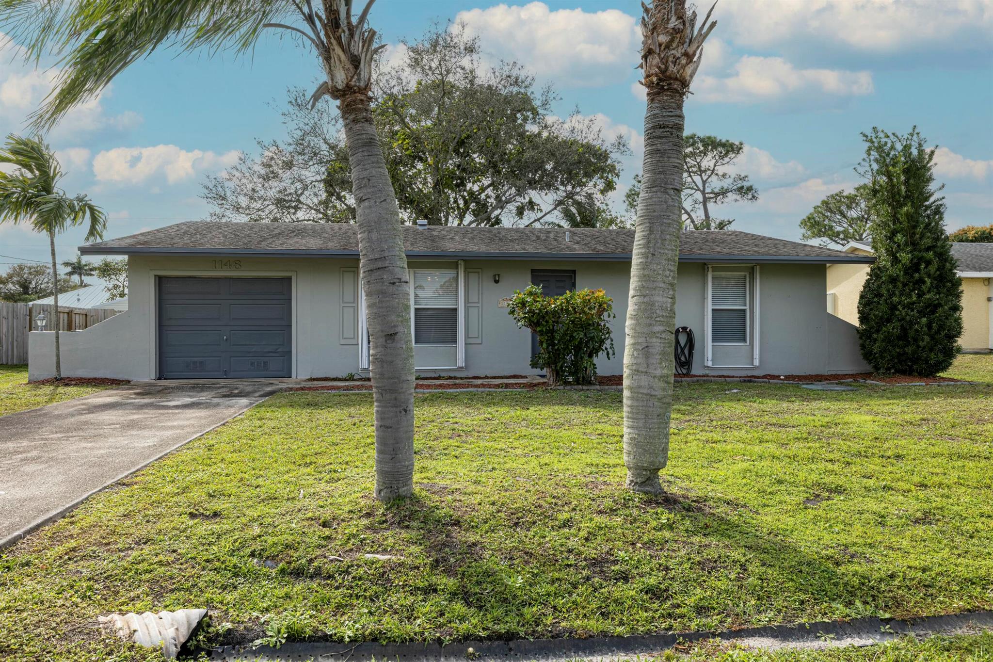 This charming two-bedroom, two-bathroom home features an extra room off the kitchen that can be utilized as an office. The floor plan includes front entry livingroom, stacked bedrooms, a spacious family room, and a well-sized utility room with washer and dryer hookup. The primary bedroom boasts two large closets; one is approximately 6 feet by 2 feet, while the second is approximately 5 feet by 2 feet. The primary ensuite and guest bathrooms have recently undergone updates. The backyard is shaded by large canopy trees.Please note that the AC unit was replaced in 2016, and the hot-water system was updated in 2023. However, there are some areas that require TLC.