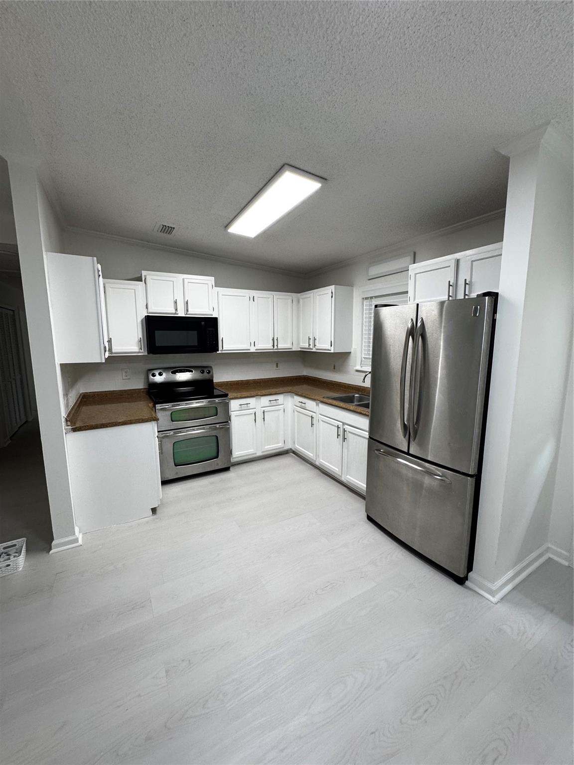 Lovely 4/2 single family home for rent. Conveniently located close to I-95 a nice and quiet street and large fenced backyard for privacy and peaceful living. Tile floors, new upgraded kitchen with a double oven, and bathrooms, Garage converted into a large room