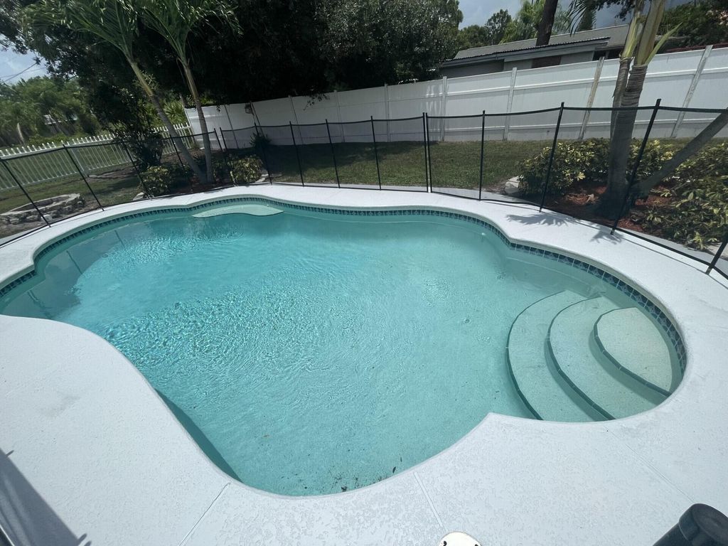 Photo of 1137 SW Coleman Avenue, Port Saint Lucie, FL 34953 (MLS # R11061985)