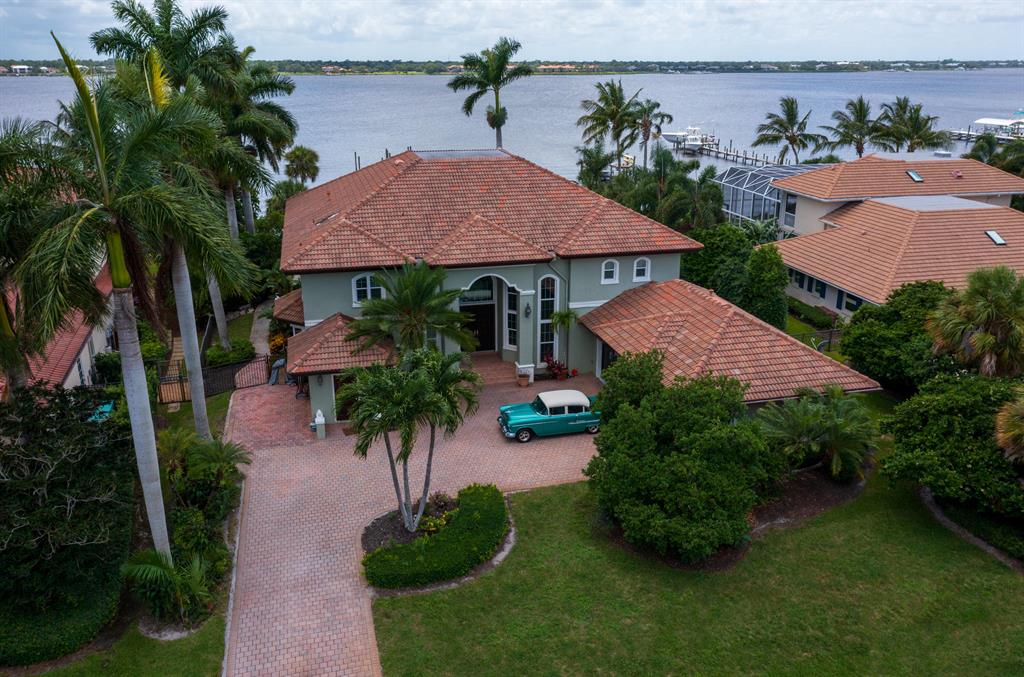 STUNNING sunset views overlooking the river. Beautiful Dock with new electric and pilings for a potential tiki bar. Mother-in-law suite on first floor with a private entrance and pool access. All new LVP flooring in bedrooms and marble tile on the first floor. Ready to entertain? The kitchen has been completely renovated with large workstation island. Gas Stove and Viking oven, wall oven and microwave, full size refrigerator, full size freezer and wine cooler. Take a walk upstairs to an interior balcony overlooking the wide water. The owners suite and office have a 336 ft balcony access. The 2 guest suites and owners suite have marble showers . Whole house generator, impact windows Please see attachments with additional upgrades. Buyer verify exposure and all measurements are approximate