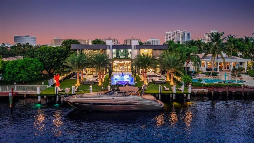 Simply the most amazing house for sale in Fort Lauderdale today!Check the full video on youtubeLocated in a private gated community with its own police patrol, South exposure on a huge overzised lot with unlimited open water views of middle river and the intracoastal. Walking distance to the beach. Stunning designer finishes including wood paneling, leather wall covering, marble, onyx, walnut wood ceilings. Smart house allowing to control everything on your phone: lights, music, temperature, doors, gates, cameras, pool. 6 bedrooms, Office, Gym, Club room, Loft, 9 bathrooms, summer kitchen, elevator, chef kitchen with SubZero and gas Wolf appliances, 20' long island and pantry, temp controlled wine cellar, new seawall and 18'X90' concrete dock expanding the lot on the water.