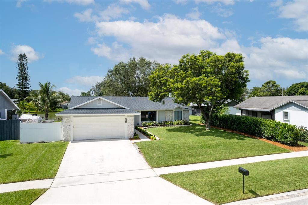 Photo of 119 Parkwood Drive, Royal Palm Beach, FL 33411 (MLS # R10732728)