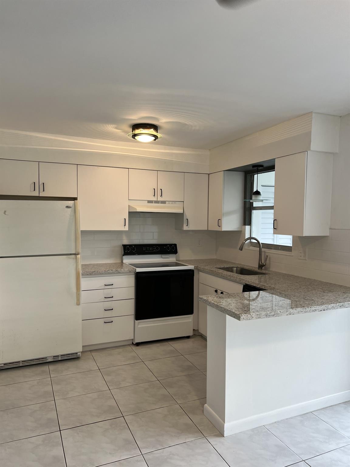 Fall in love with this charming 2BR, 1.5BA townhouse-style condo just 2 miles from the beach in East Deerfield! Tucked away in a quiet community just west of Federal Hwy, this bright two-story condo features an open kitchen with granite counters, wood cabinetry. The spacious living and dining area opens to a large screened terrace—perfect for morning coffee or evening relaxation. Upstairs, two oversized bedrooms offer generous closets and great natural light. With a ton of closet space, storage won’t be an issue! Condo fees include water, sewer, trash, roof maintenance, insurance, and reserves. Enjoy recent exterior updates including a new roof and concrete restoration. Close to shopping, restaurants, and everything you need—beachside living at its best!