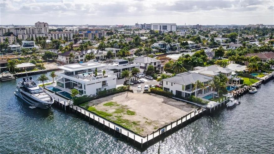 Rare opportunity to own one of Fort Lauderdale's premier point lots.  Unobstructed and unmatched views, over 250 feet of water frontage, amazing sunrise and open water views.  The lot comes with approved plans, paid for permits to quickly start building as well as a full set of interior and exterior renderings.