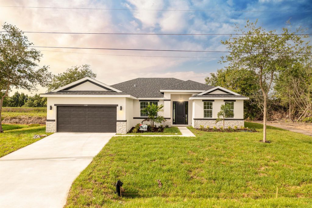 Photo of 5811 NW Dooley Circle, Port Saint Lucie, FL 34986 (MLS # R10987819)