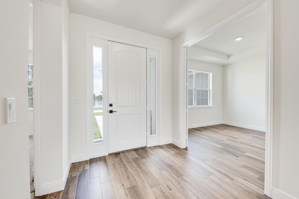 Photo of 5811 NW Dooley Circle, Port Saint Lucie, FL 34986 (MLS # R10987819)