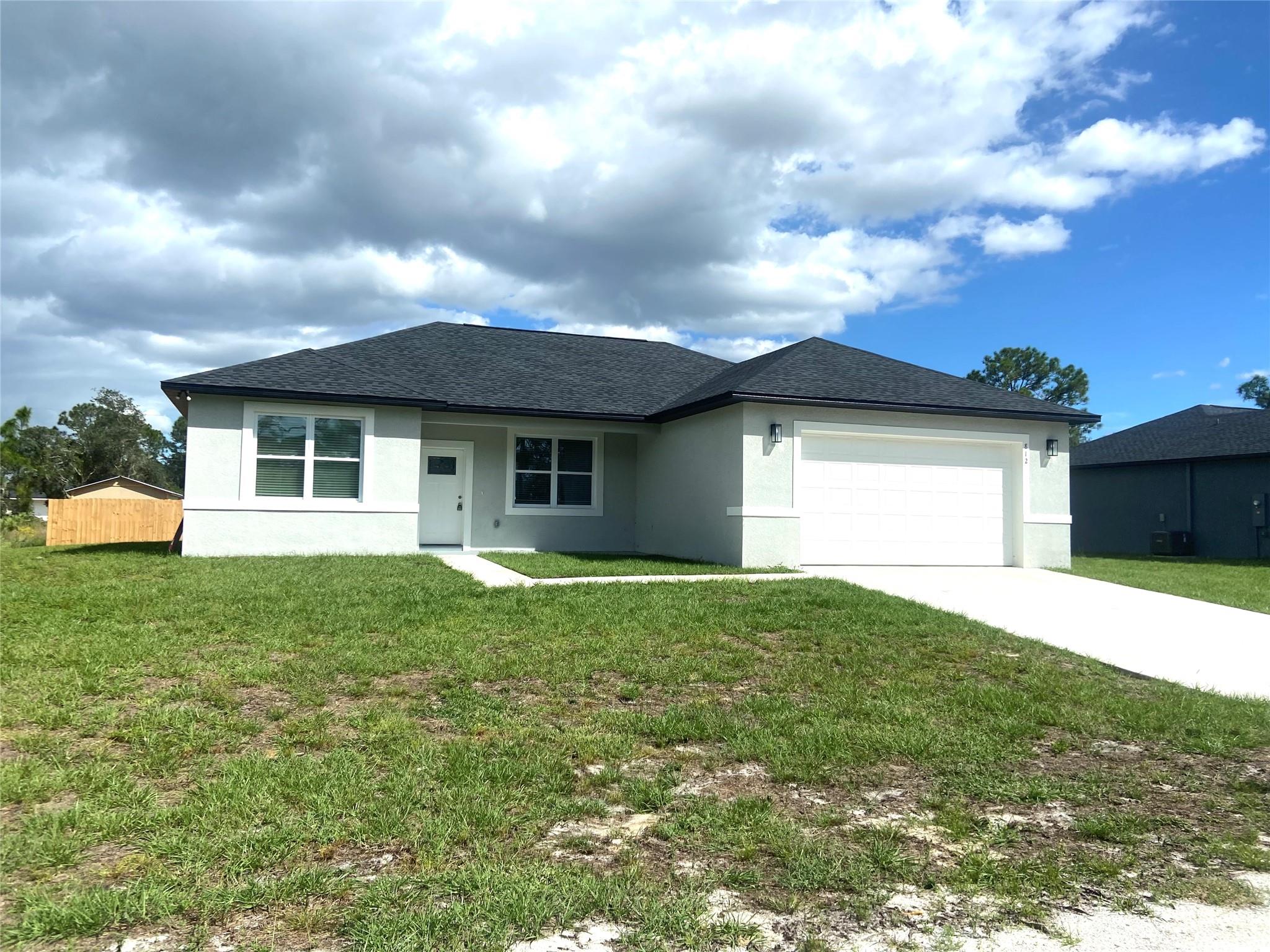 New block construction in the heart of Sebring in the desirable area of Sebring Country Estates.. Entire home is ceramic tile flooring. Open concept with great room. Spacious kitchen features recessed LED lights, an Island, granite counter tops, stainless steel appliances and wood cabinets with soft close doors and crown molding.
Primary BdRm features a large walk in closet. Also features an in-suite master bath with double vanities, granite counter tops & tiled walk-in shower with glass shower door. There is a full bath and a linen closet in the hallway. The hall bath has granite counter top & tiled tub/shower combo. The garage comes with recessed lighting. Sebring International Raceway is 13 miles, FL State College 7 miles.