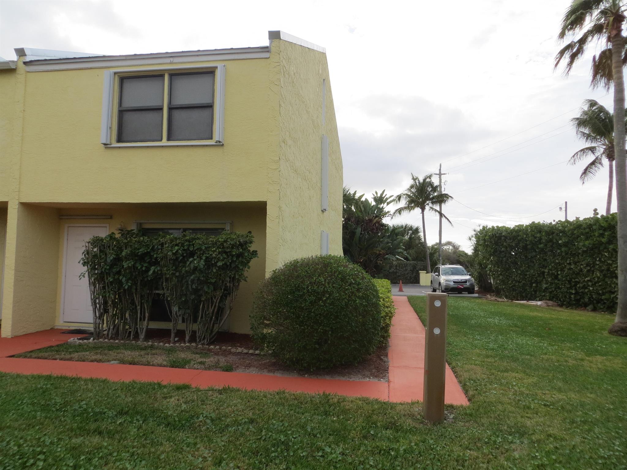 Rarely available end unit in lovely Galleon Townhomes located across the street from the beach. Deeded beach access. Super low HOA fees. This end-unit home has extra light from side windows upstairs and downstairs. Brand new efficient Central Air system. The entire upstairs has been redone including bathroom vanities, counters, flooring and ceilings and lighting. New kitchen and downstairs bathroom were recently finished including new white shaker style cabinets and quartz counters. New metal roof in 2022. New stainless-steel refrigerator, glass top electric range, microwave and dishwasher. All of the high dollar items have been replaced bringing peace of mind and nothing but fun! All measurements are approximate. Buyer's agent to verify. Owner is a licensed Florida real estate broke