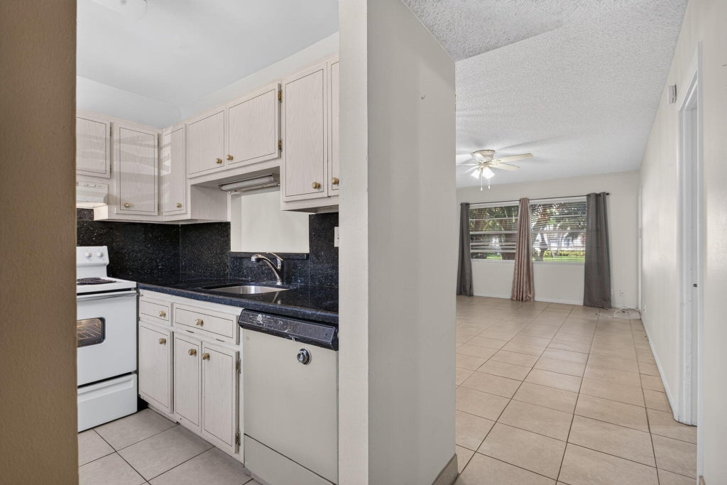 Photo of 5181 W OAKLAND PARK Boulevard #104, Lauderdale Lakes, FL 33313 (MLS # B26076805)